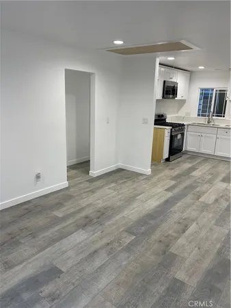 a view of a kitchen with a sink