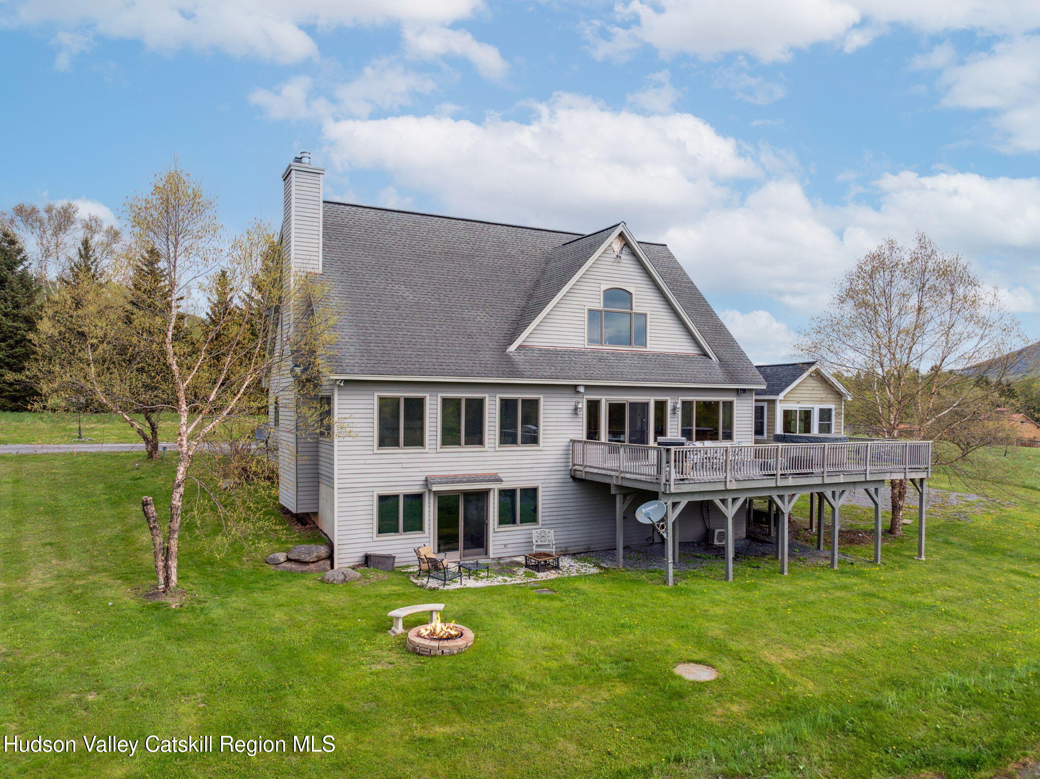 2 Biff Andrus Road Windham, NY 12496 - Photo 1 of 35 a aerial view of a house with a yard table and chairs