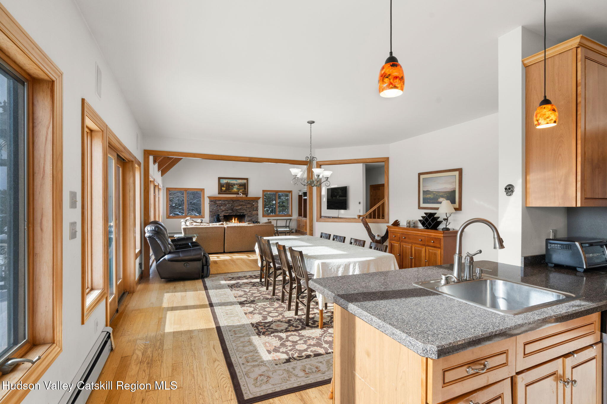 2 Biff Andrus Road Windham, NY 12496 - Photo 14 of 35 a living room with furniture a rug and a chandelier