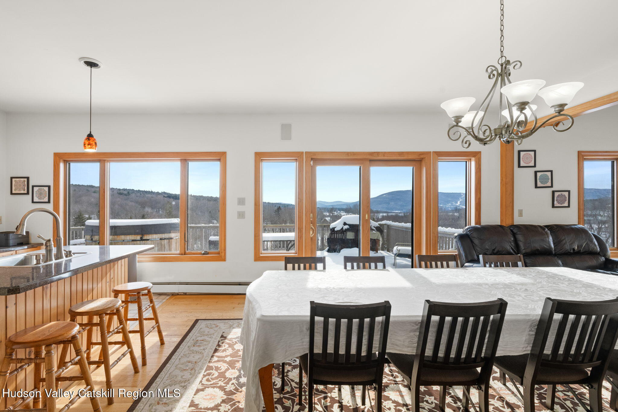 2 Biff Andrus Road Windham, NY 12496 - Photo 9 of 35 a view of a dining room with furniture large windows and a chandelier