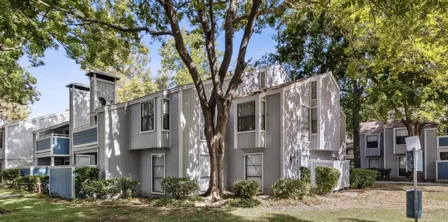 a view of a building with a tree