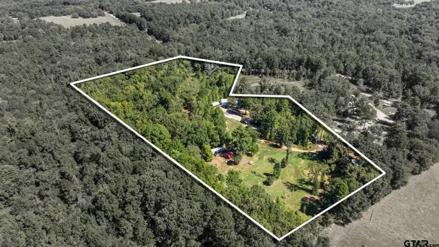 a view of a two chairs in the balcony