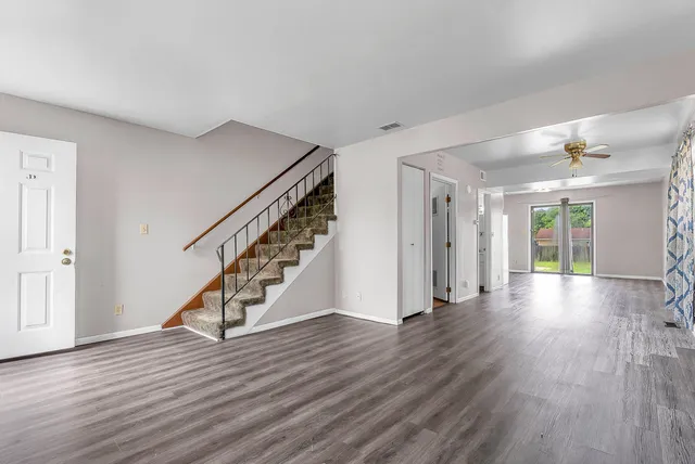 a view of an entryway with wooden floor