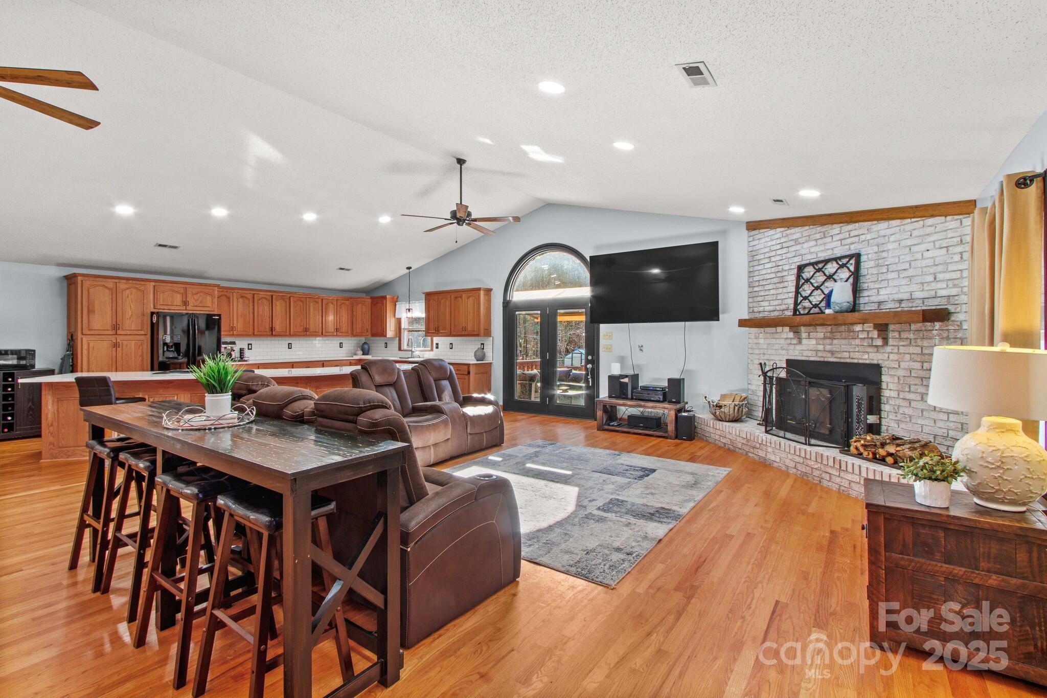 295 Rimer Road Salisbury, NC 28146 - Photo 12 of 48 a living room with furniture a fireplace and a flat screen tv