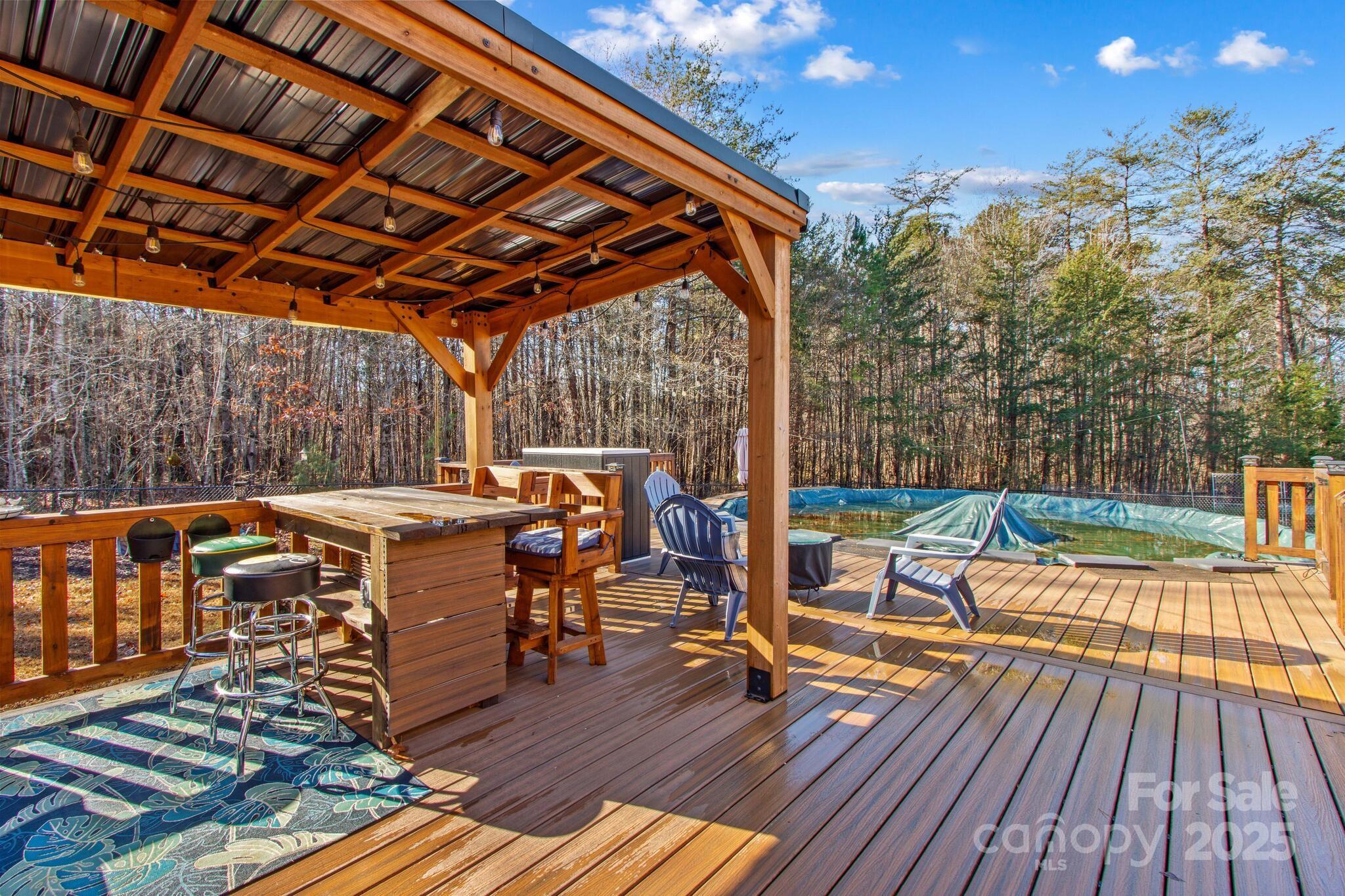 295 Rimer Road Salisbury, NC 28146 - Photo 27 of 48 a view of deck with table and chairs a barbeque with wooden floor and fence