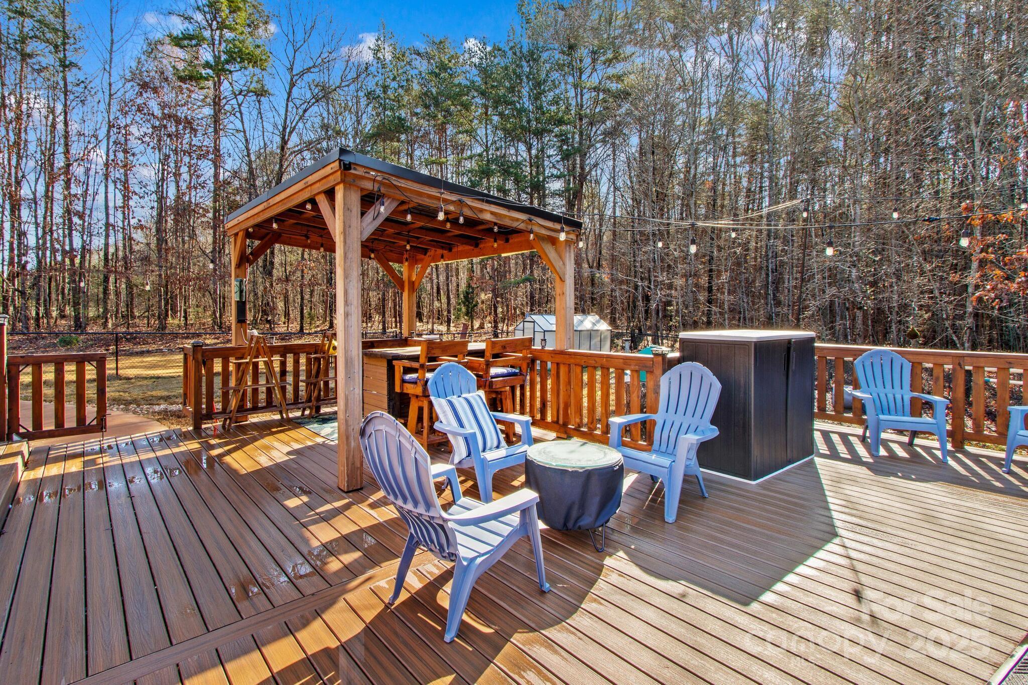 295 Rimer Road Salisbury, NC 28146 - Photo 29 of 48 a view of a roof deck with table and chairs wooden floor and fence