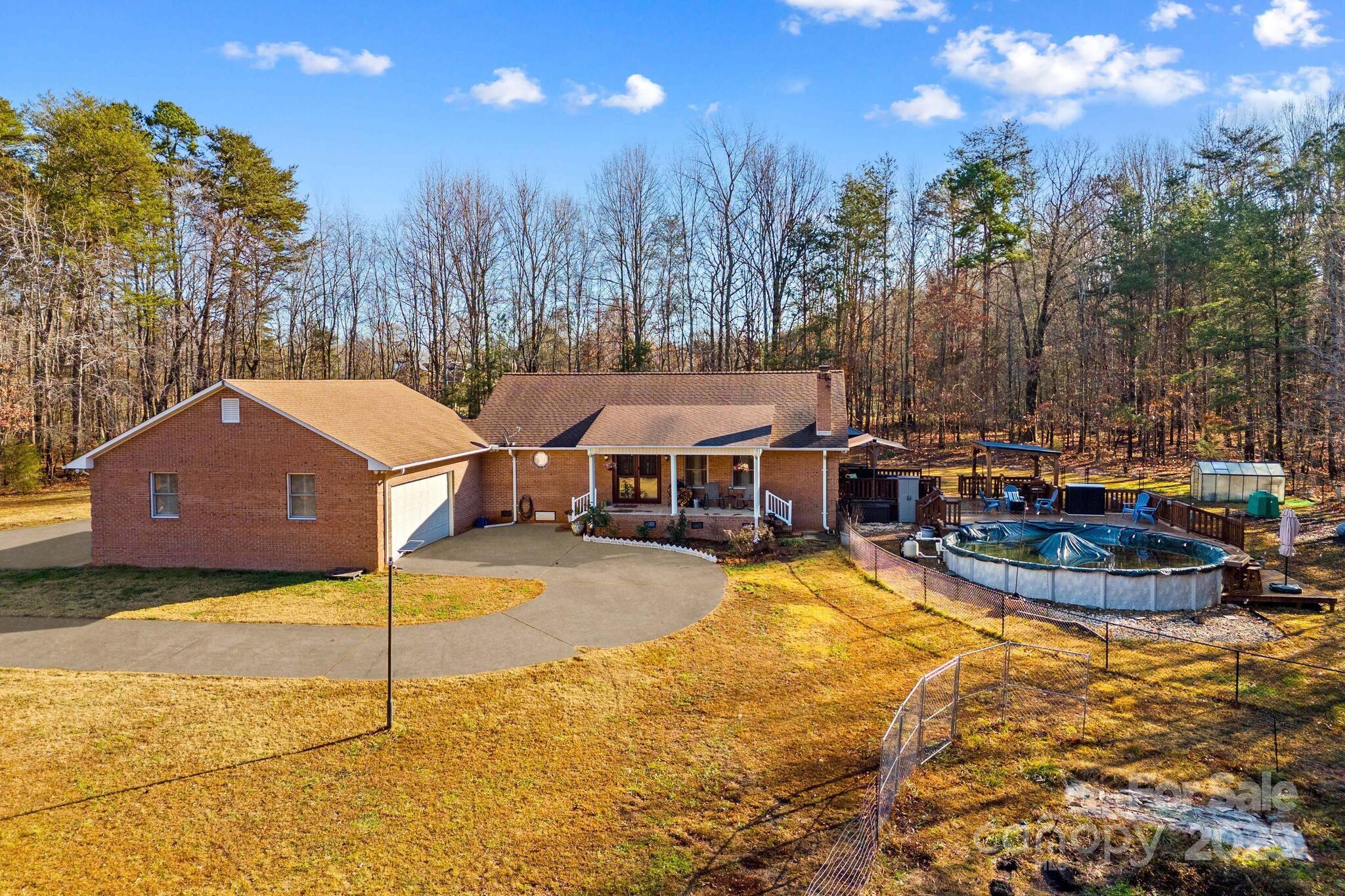 295 Rimer Road Salisbury, NC 28146 - Photo 3 of 48 a view of a house with swimming pool and sitting area