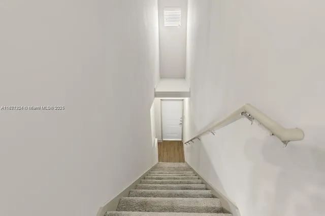 a view of a hallway with staircase