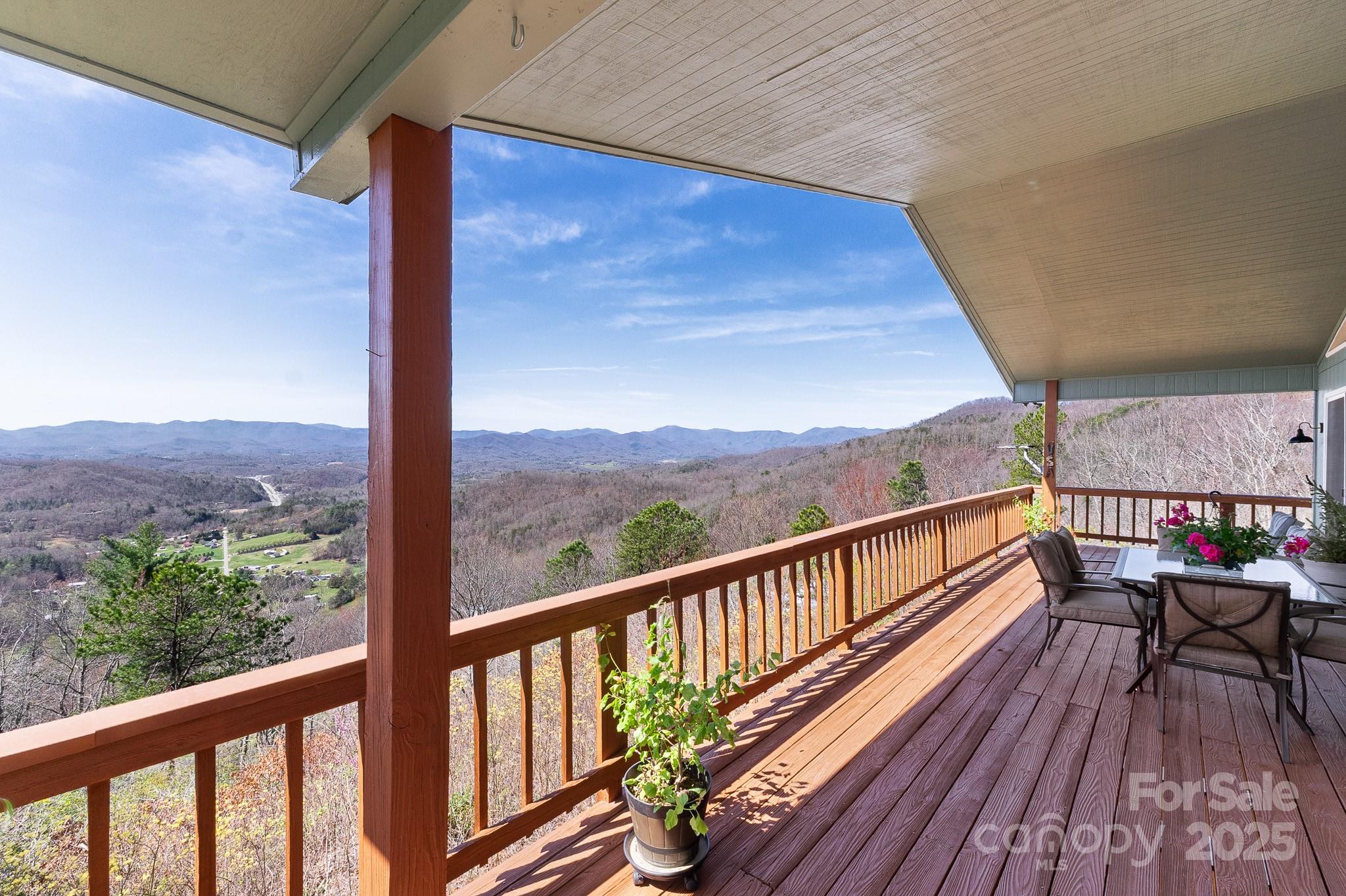a view of a balcony with wooden floor