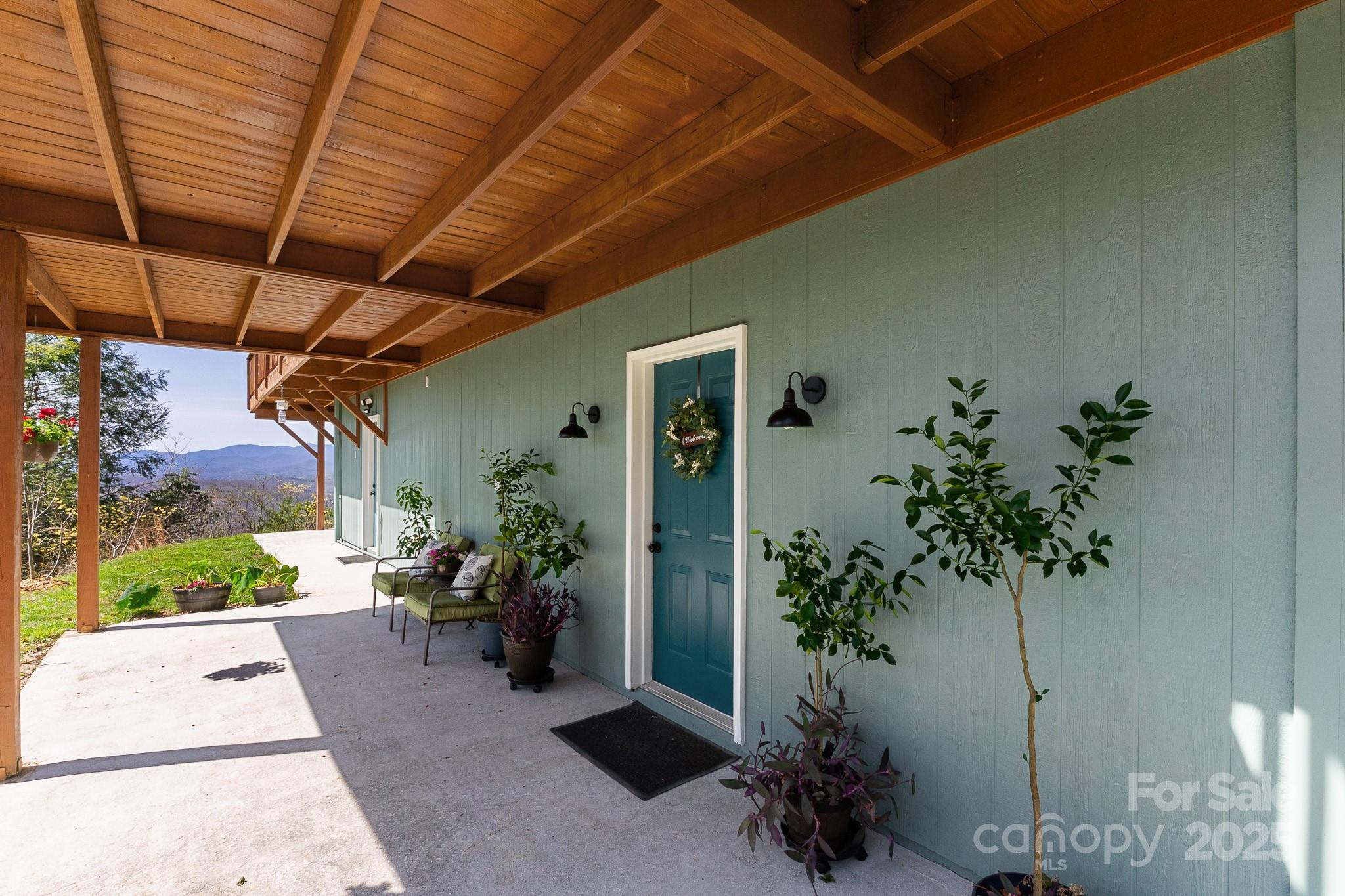 727 Chinquapin Mountain Road Franklin, NC 28734 - Photo 34 of 47 a view of a porch with potted plants