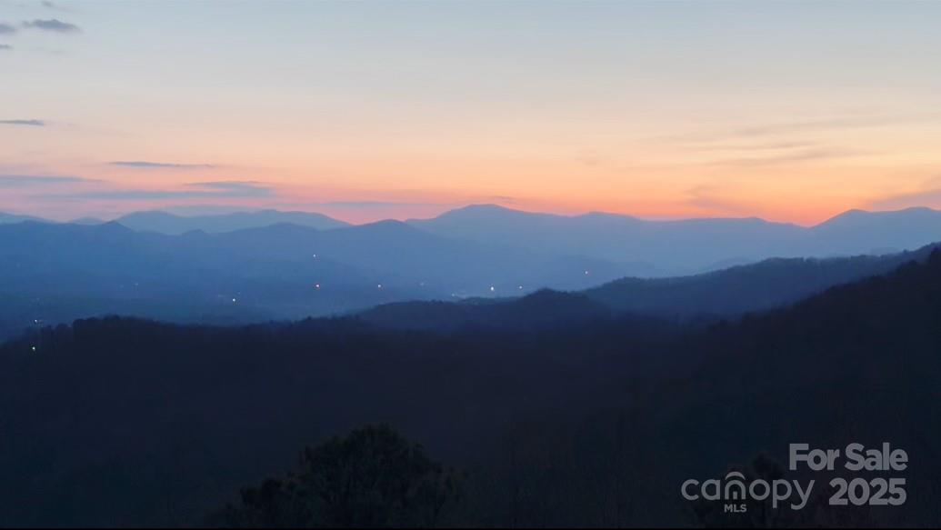 727 Chinquapin Mountain Road Franklin, NC 28734 - Photo 38 of 47 a view of a city with sunset view