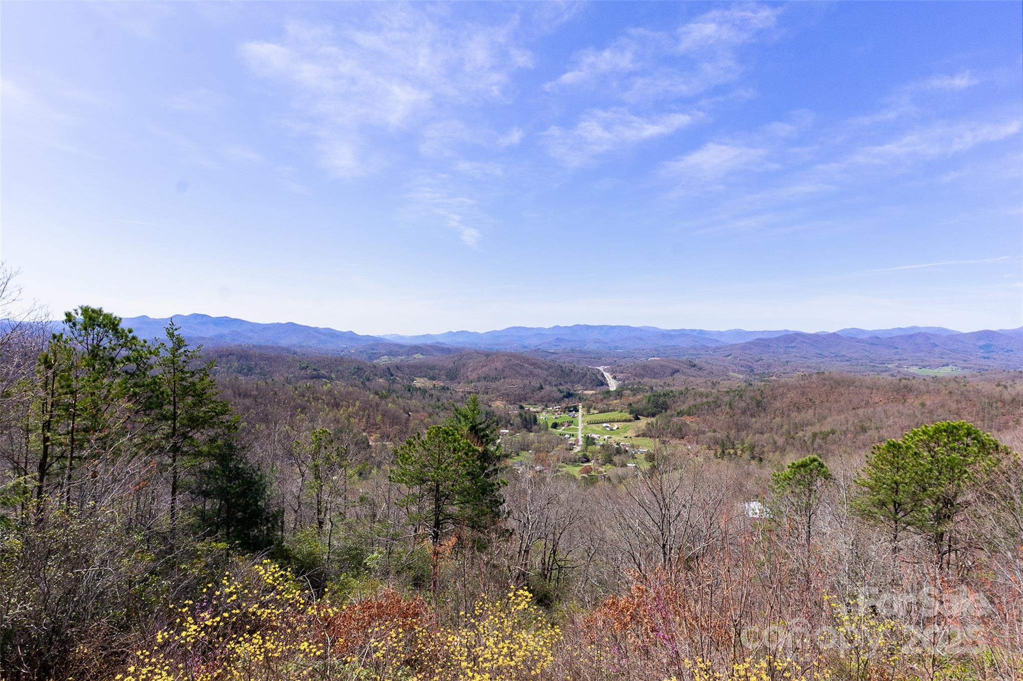 727 Chinquapin Mountain Road Franklin, NC 28734 - Photo 41 of 47 a view of a lake with mountains in the background