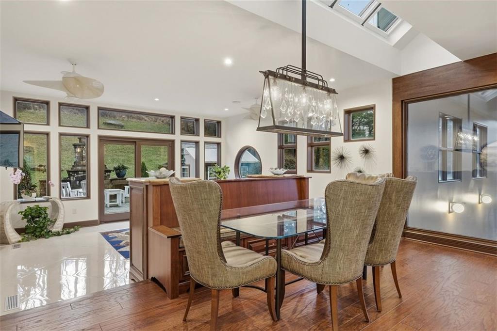 514 Justabout Road Venetia, PA 15367 - Photo 23 of 50 a dining room with furniture a chandelier and wooden floor