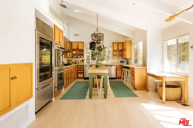 a en suite bathroom with a sink a mirror and a bathtub