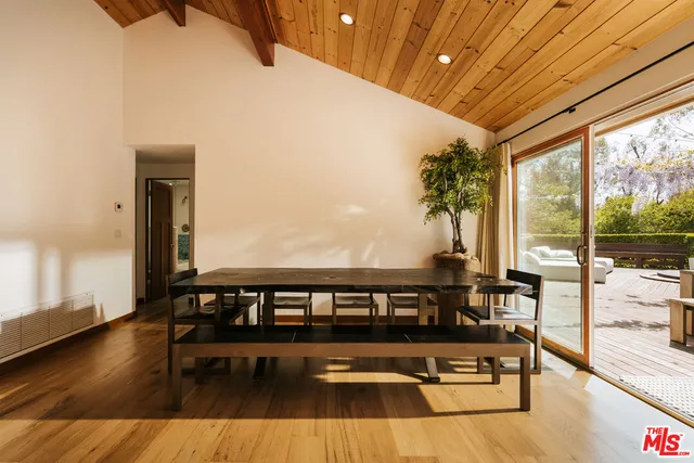 a view of a swimming pool with seating space