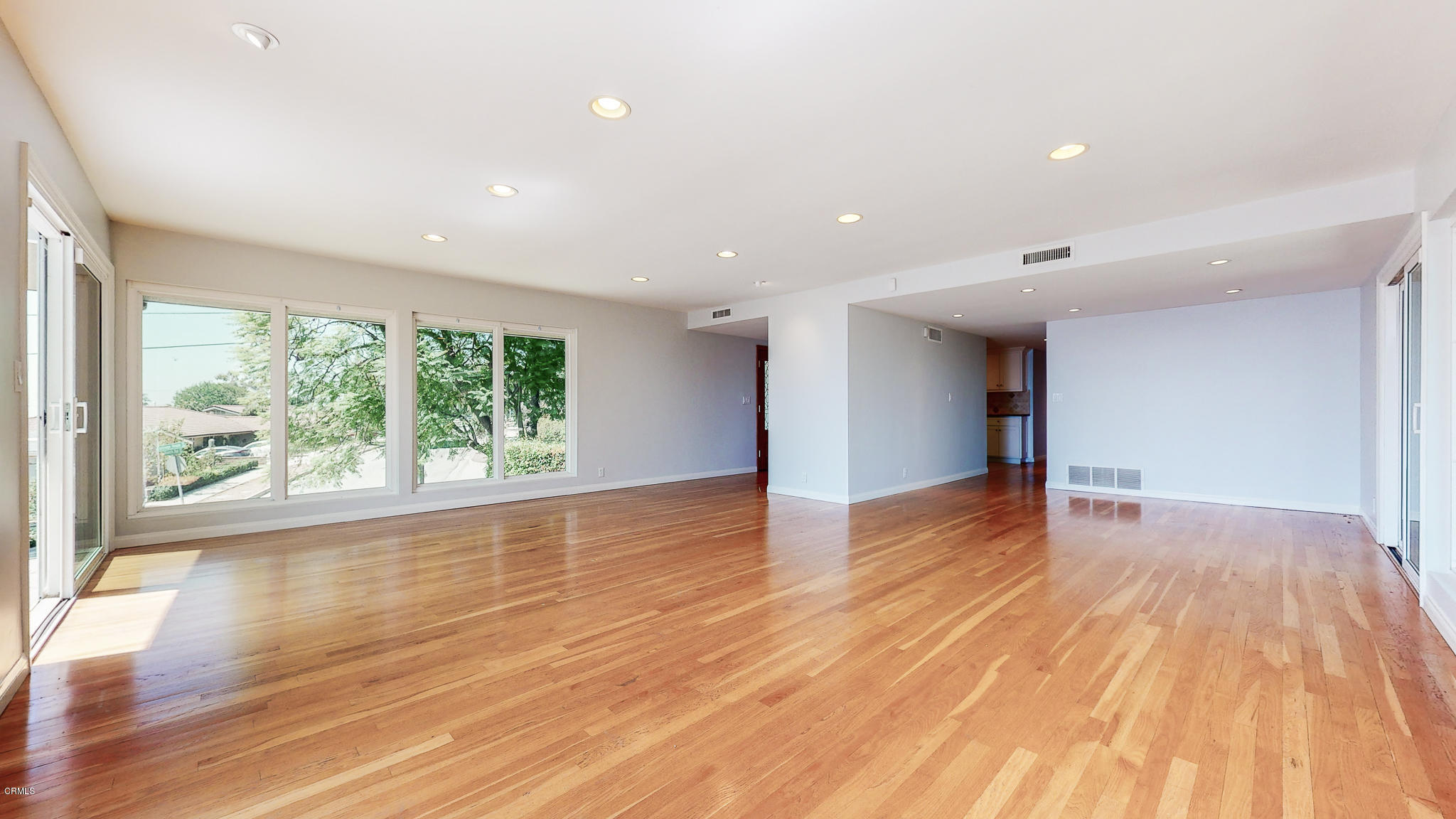 1610 Carriage House Road Pasadena, CA 91107 - Photo 17 of 54 a view of an empty room with wooden floor and a window