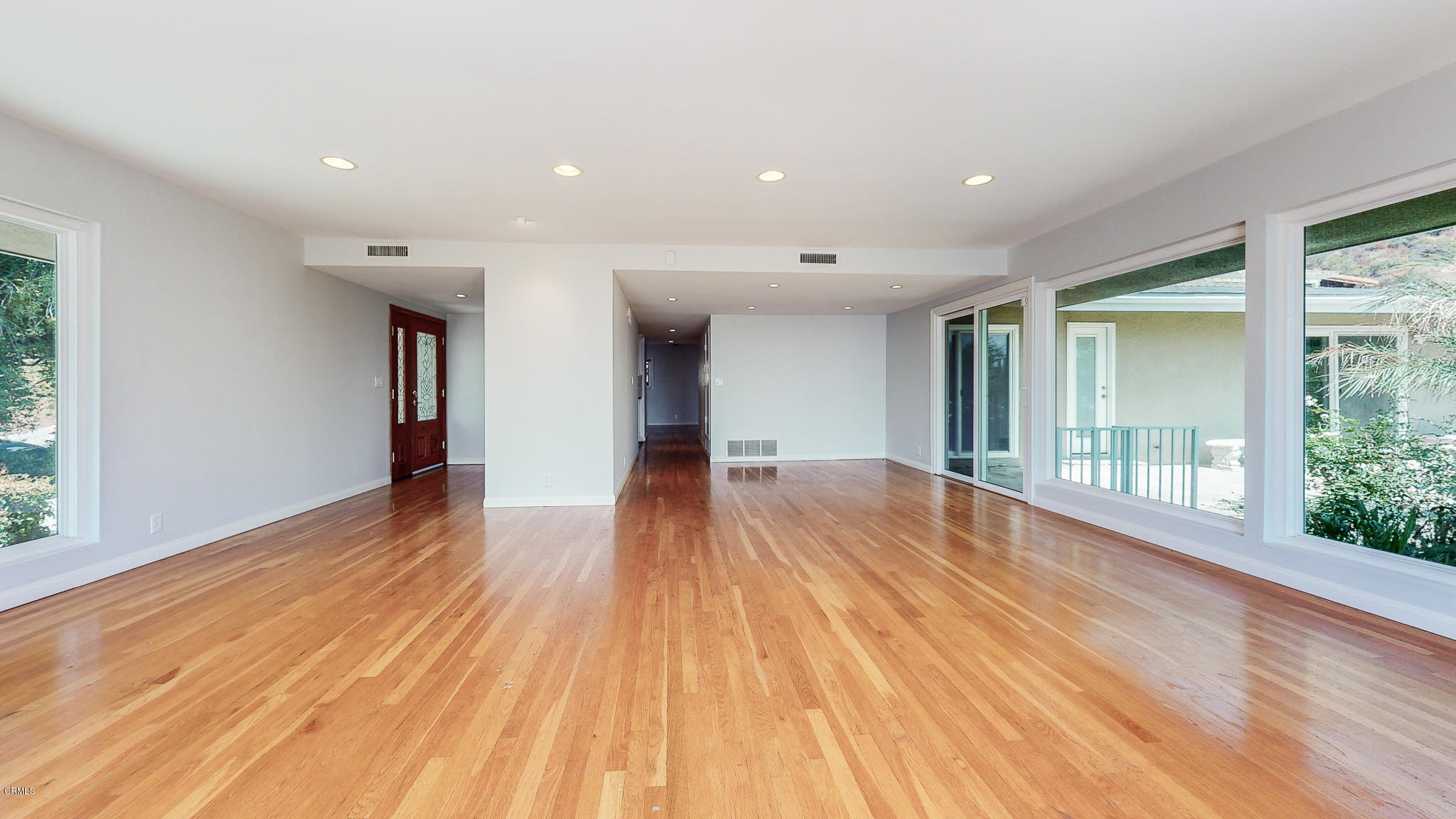 1610 Carriage House Road Pasadena, CA 91107 - Photo 19 of 54 a view of empty room with wooden floor and fan