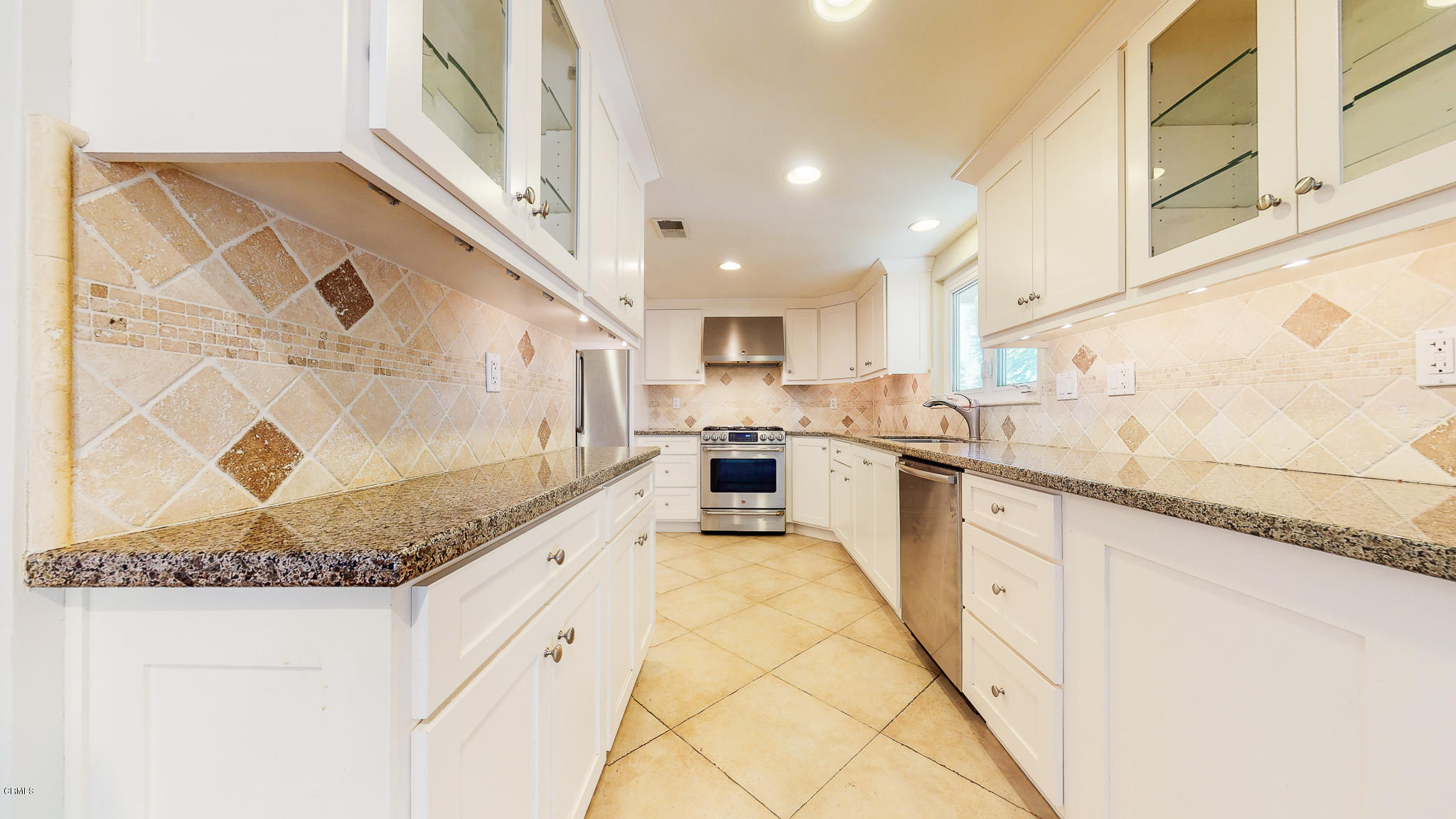 1610 Carriage House Road Pasadena, CA 91107 - Photo 27 of 54 a large white kitchen with stainless steel appliances granite countertop a sink and cabinets