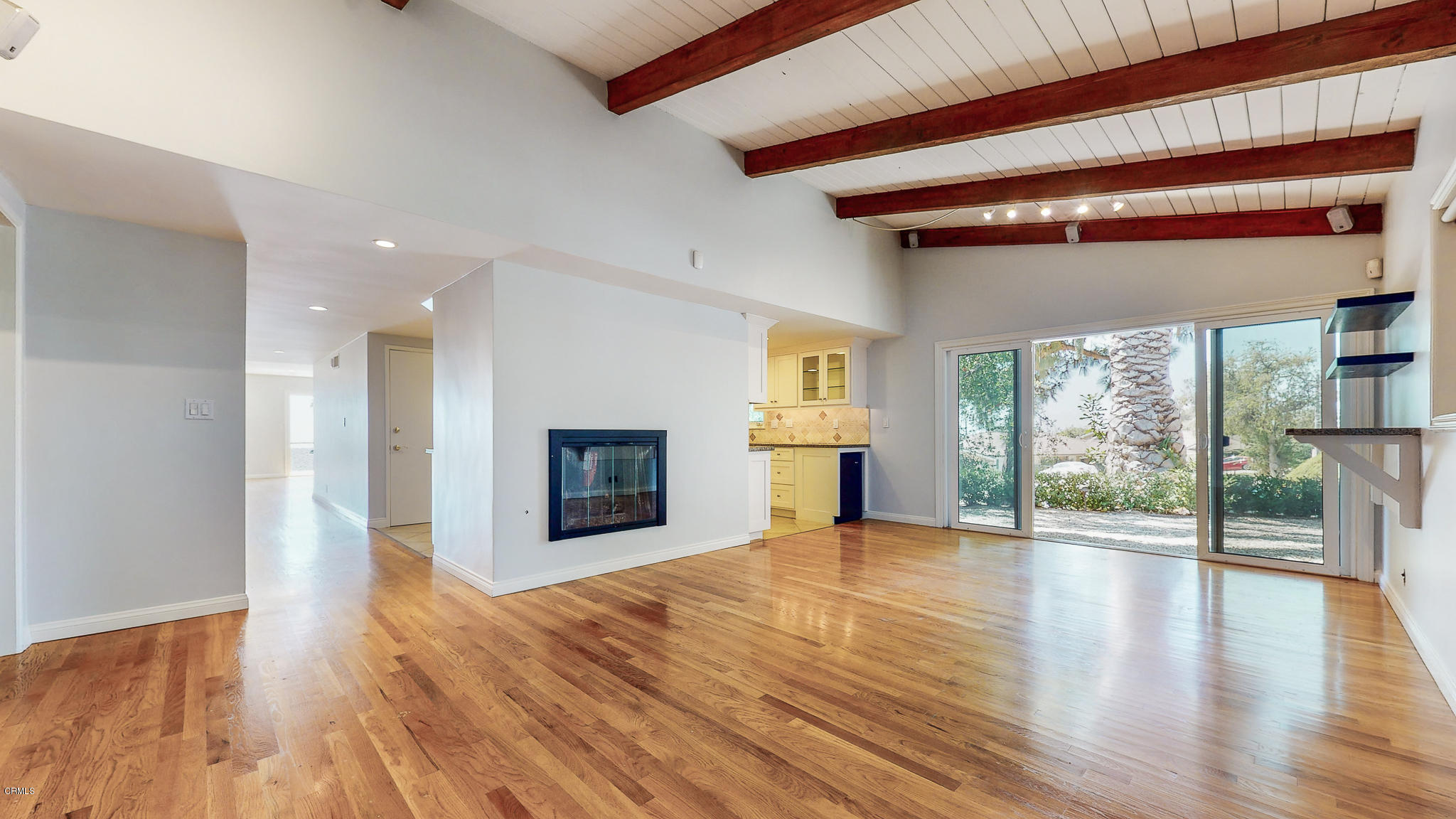 1610 Carriage House Road Pasadena, CA 91107 - Photo 33 of 54 a view of an empty room with wooden floor and a fireplace