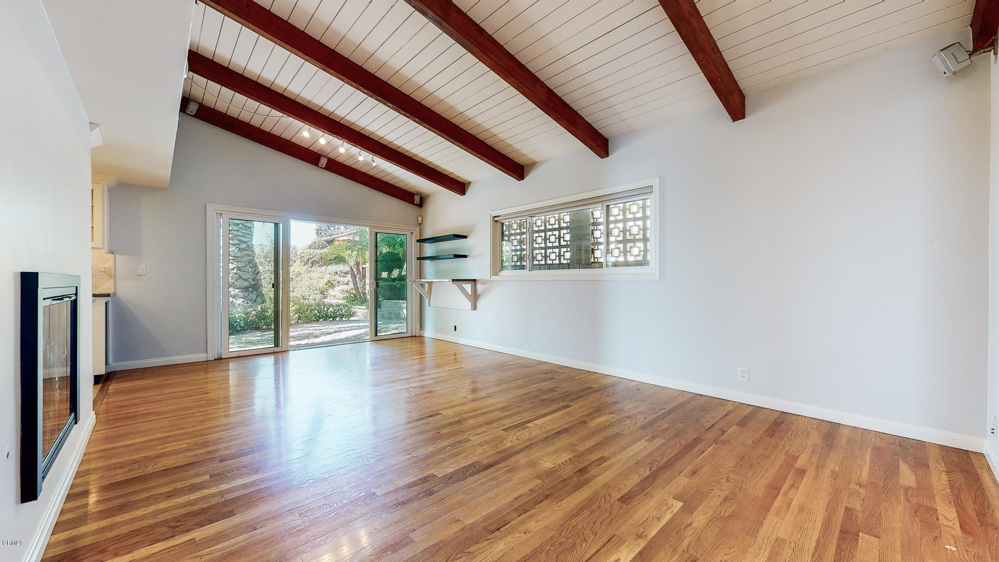 1610 Carriage House Road Pasadena, CA 91107 - Photo 35 of 54 a view of an empty room with wooden floor and a window