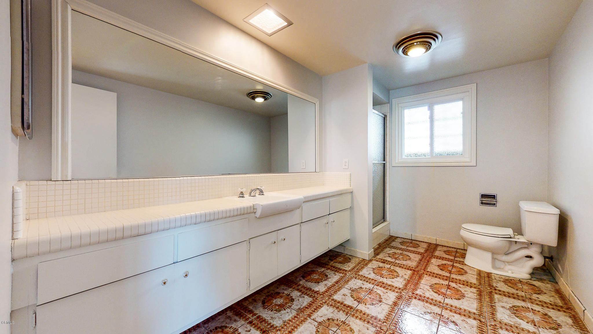 1610 Carriage House Road Pasadena, CA 91107 - Photo 36 of 54 a bathroom with a double vanity sink mirror and toilet
