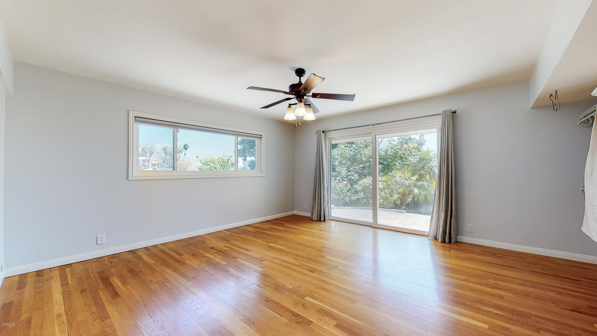 1610 Carriage House Road Pasadena, CA 91107 - Photo 37 of 54 a view of an empty room with wooden floor and a window
