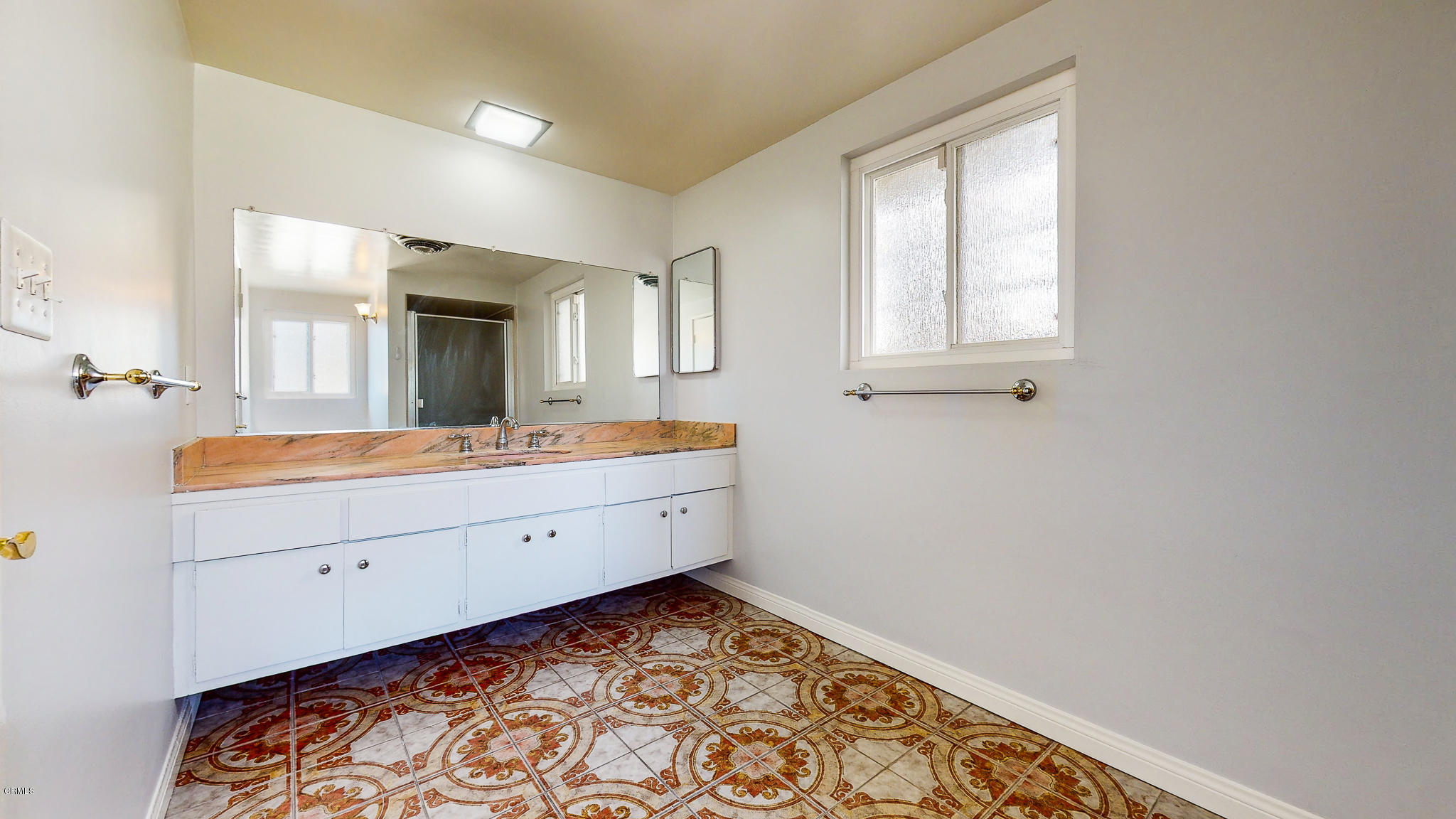 1610 Carriage House Road Pasadena, CA 91107 - Photo 39 of 54 a spacious bathroom with a double vanity sink and a mirror