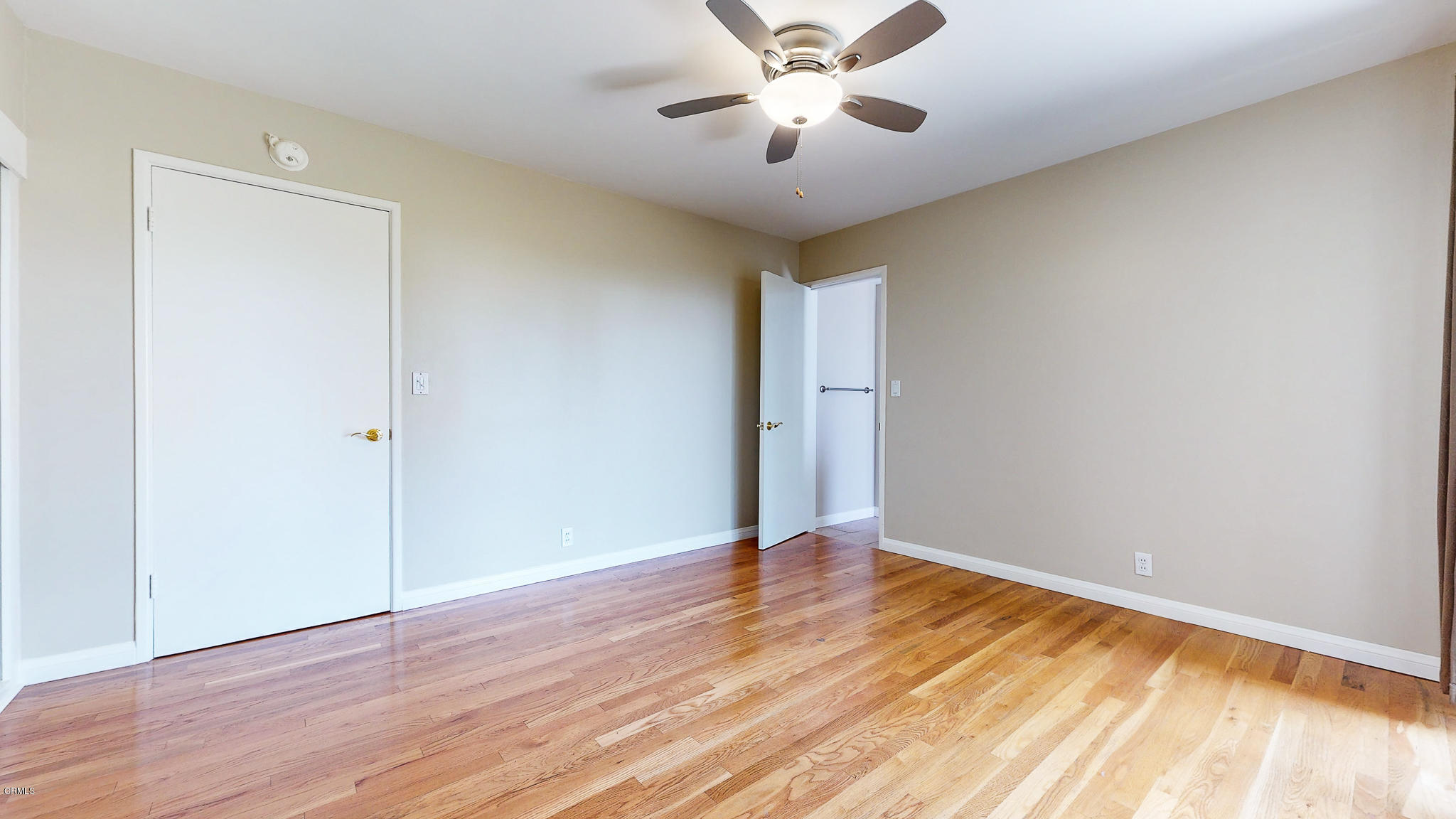 1610 Carriage House Road Pasadena, CA 91107 - Photo 41 of 54 an empty room with wooden floor and windows