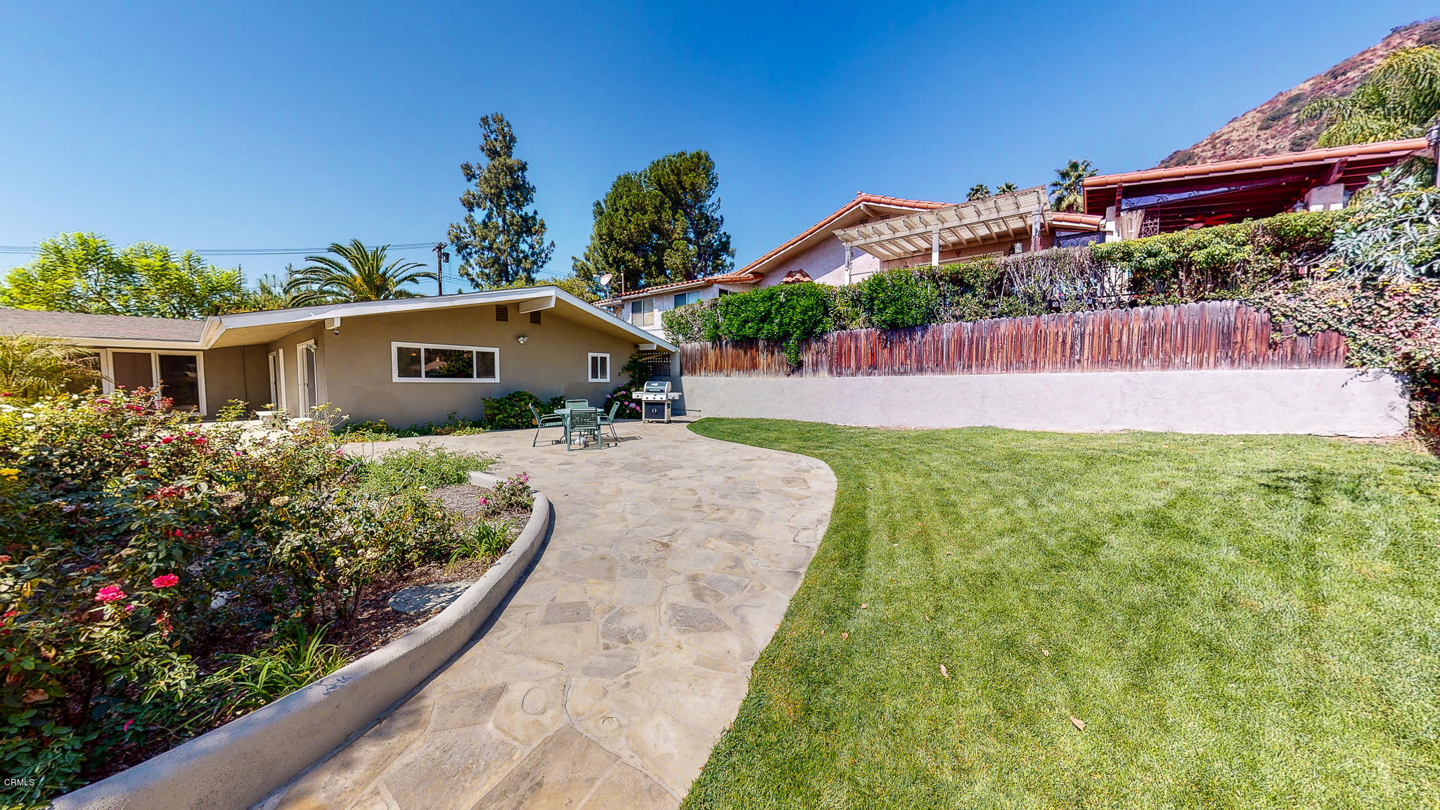 1610 Carriage House Road Pasadena, CA 91107 - Photo 51 of 54 a front view of a house with a yard and potted plants