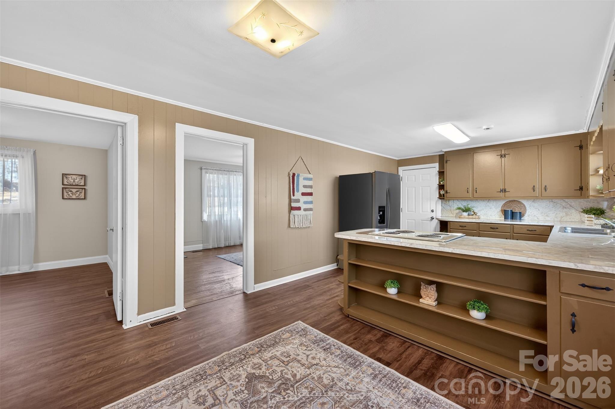 1708 Emmanuel Church Road Conover, NC 28613 - Photo 11 of 27 a living room with stainless steel appliances kitchen island granite countertop a stove and a wooden floors