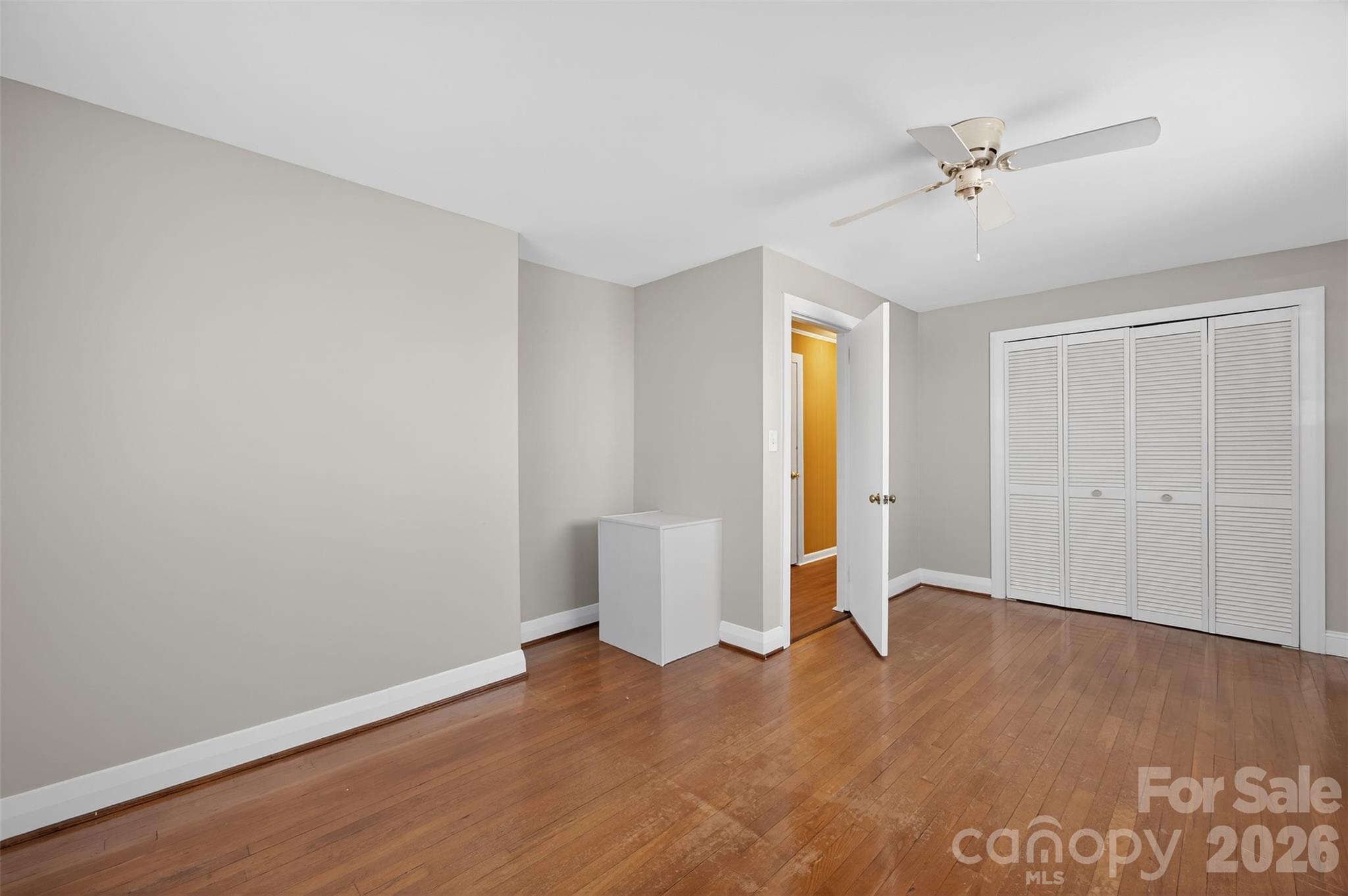 1708 Emmanuel Church Road Conover, NC 28613 - Photo 20 of 27 wooden floor in an empty room with a window