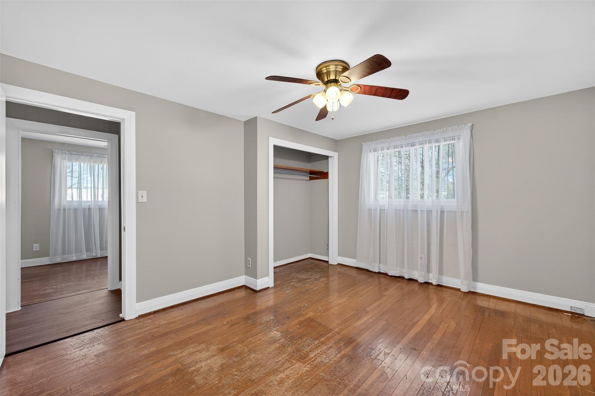 1708 Emmanuel Church Road Conover, NC 28613 - Photo 23 of 27 a view of an empty room with wooden floor and a window
