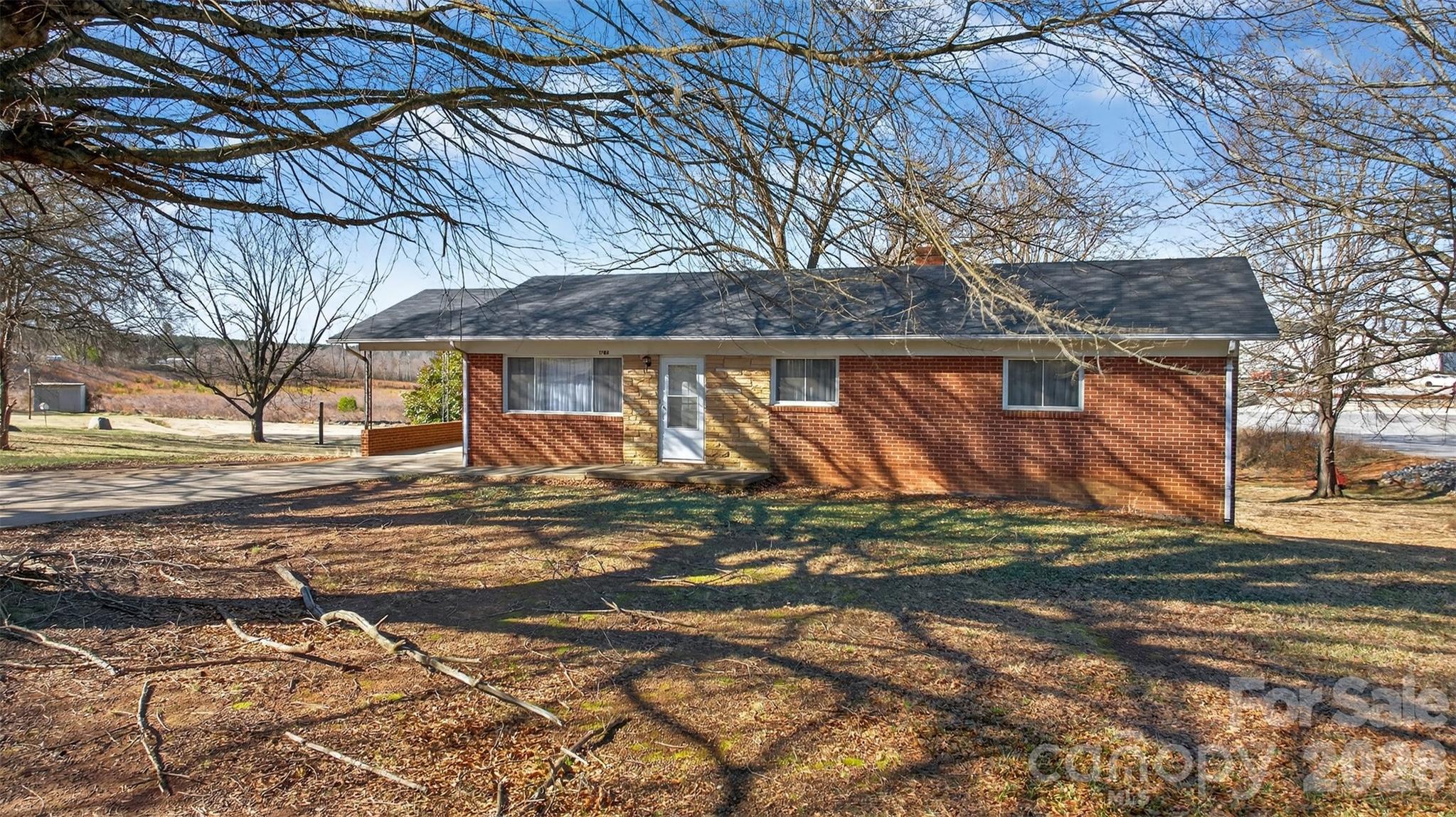 1708 Emmanuel Church Road Conover, NC 28613 - Photo 5 of 27 a view of a yard with a tree
