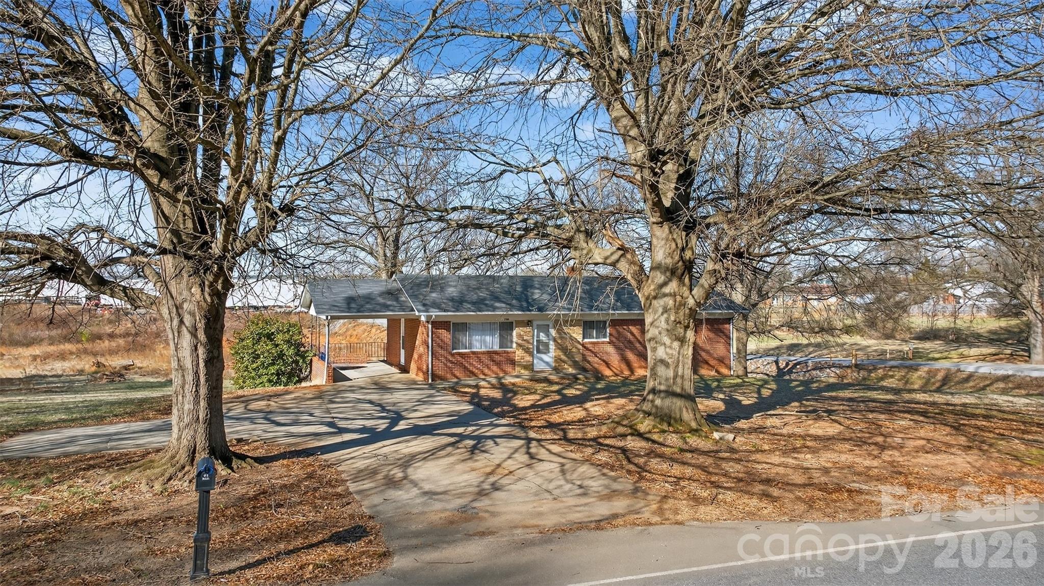 1708 Emmanuel Church Road Conover, NC 28613 - Photo 6 of 27 a view of a yard with large trees