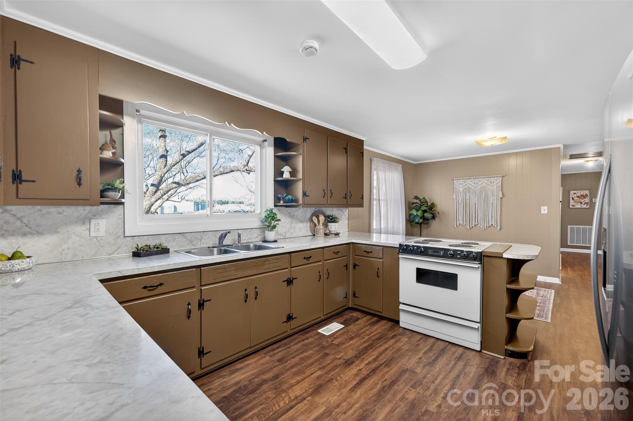 1708 Emmanuel Church Road Conover, NC 28613 - Photo 7 of 27 a kitchen with a sink stove and cabinets