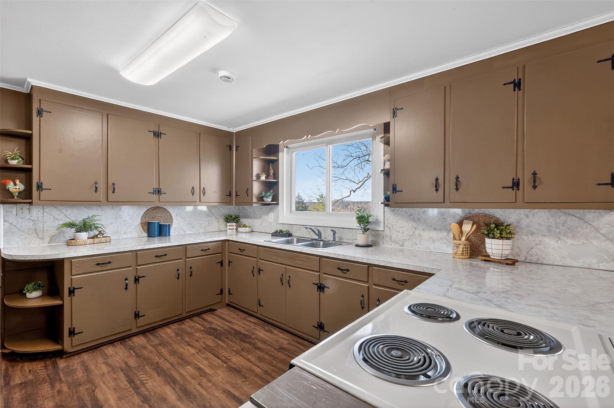 1708 Emmanuel Church Road Conover, NC 28613 - Photo 8 of 27 a kitchen with a sink stove and cabinets
