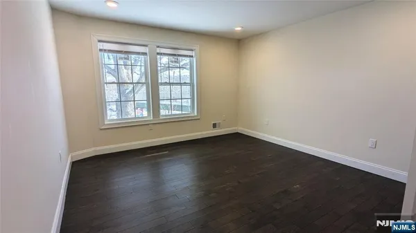 a bathroom with a sink toilet vanity and shower