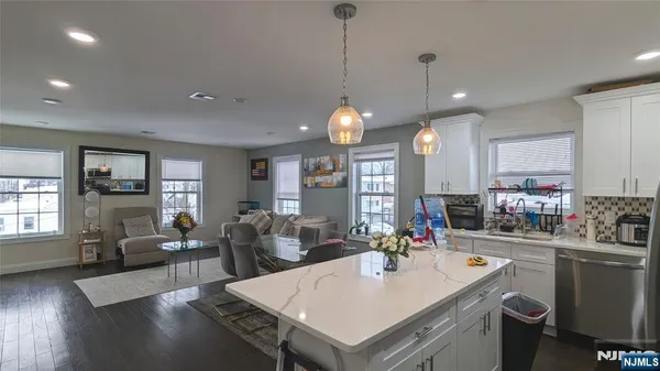 a bedroom with a bed and a mirror