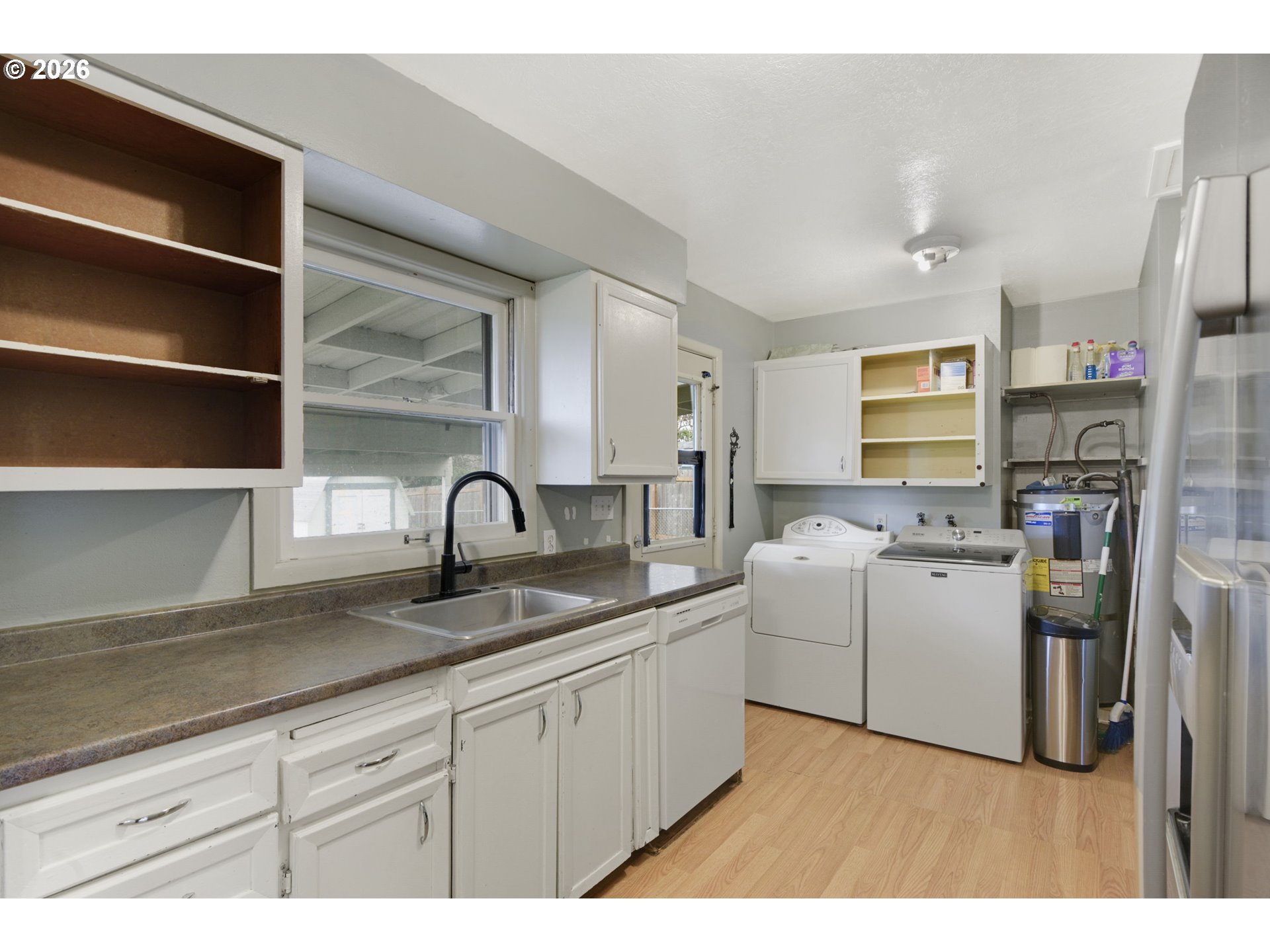 106 North Lieser Road Vancouver, WA 98664 - Photo 17 of 36 a kitchen with a sink white cabinets and stainless steel appliances