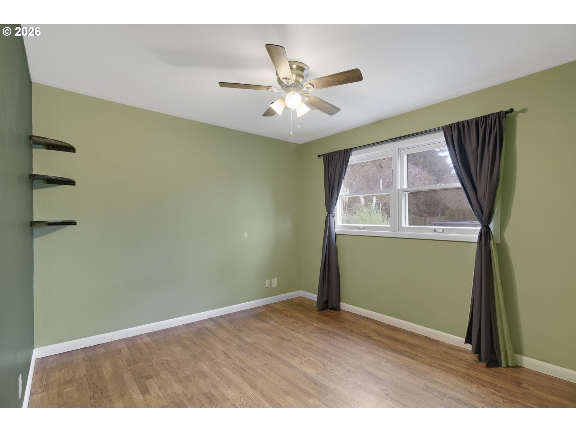106 North Lieser Road Vancouver, WA 98664 - Photo 26 of 36 a view of an empty room with wooden floor and a window