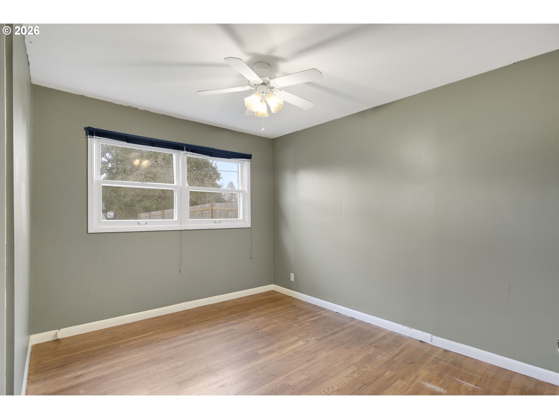 106 North Lieser Road Vancouver, WA 98664 - Photo 28 of 36 a view of an empty room with wooden floor and a window