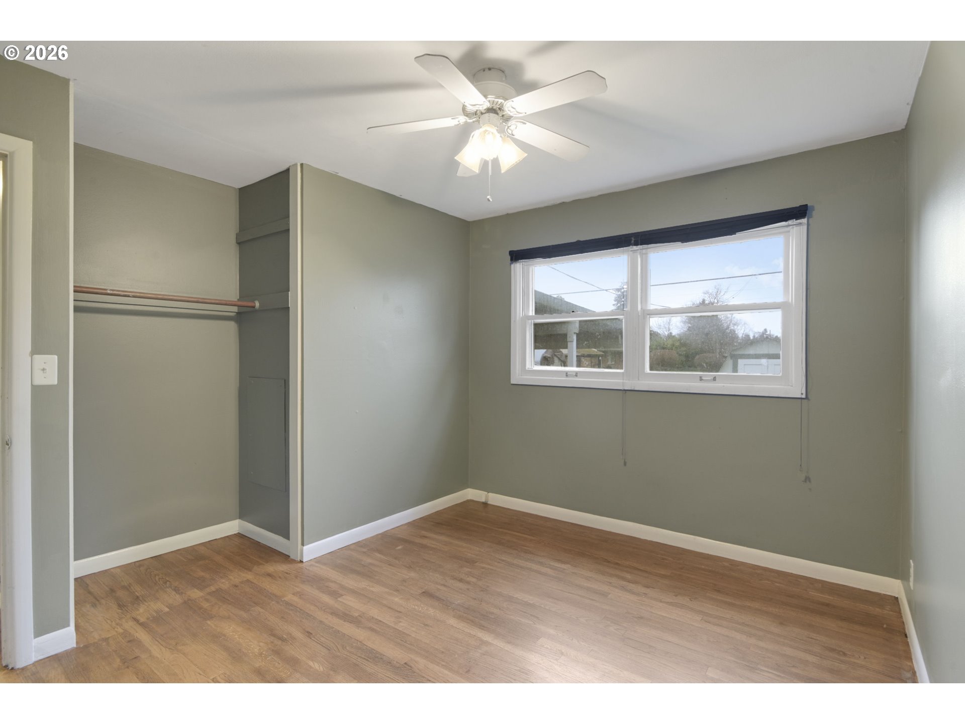 106 North Lieser Road Vancouver, WA 98664 - Photo 29 of 36 a view of an empty room with a window and wooden floor