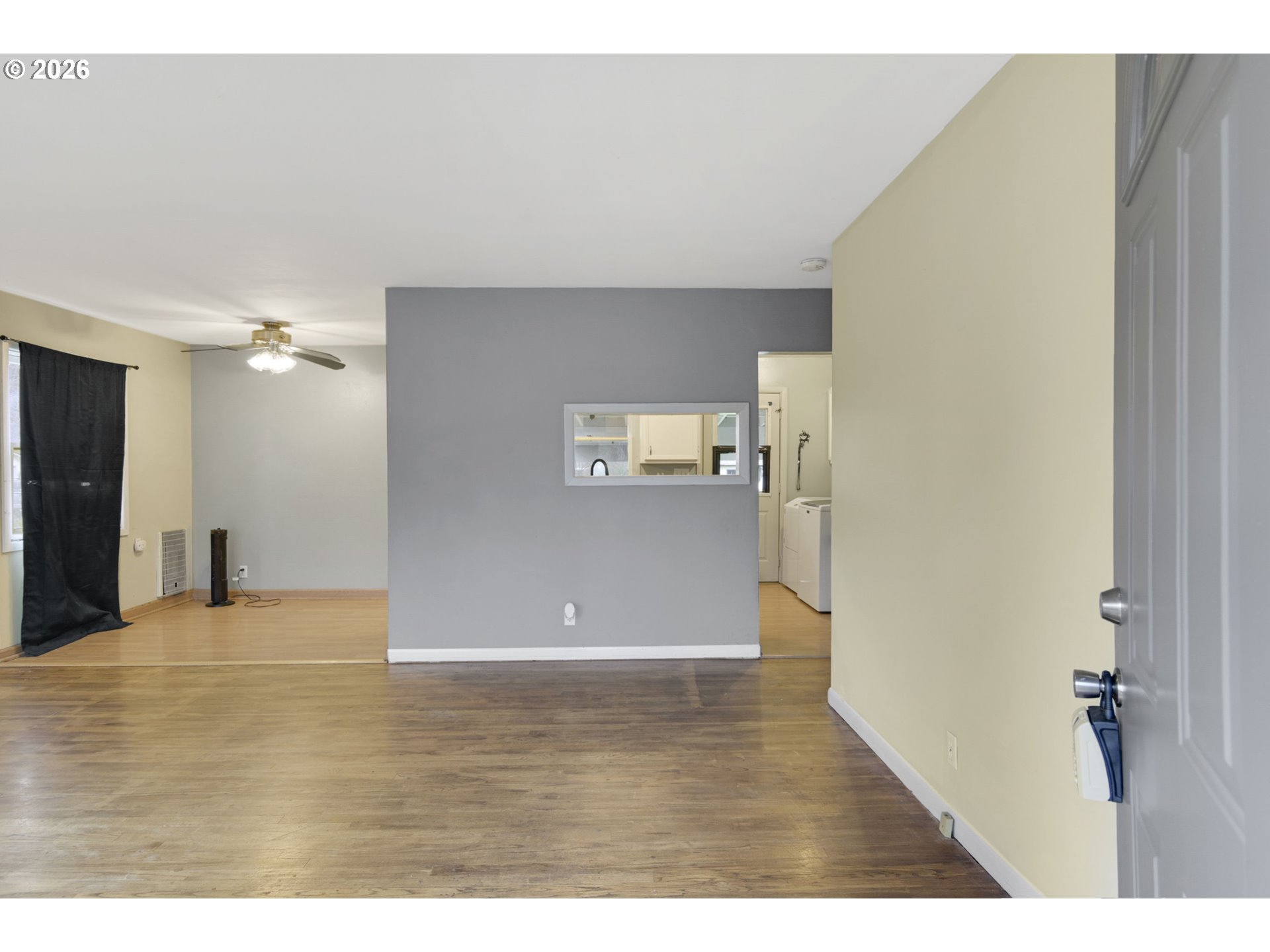 106 North Lieser Road Vancouver, WA 98664 - Photo 3 of 36 a view of a big room with wooden floor and windows