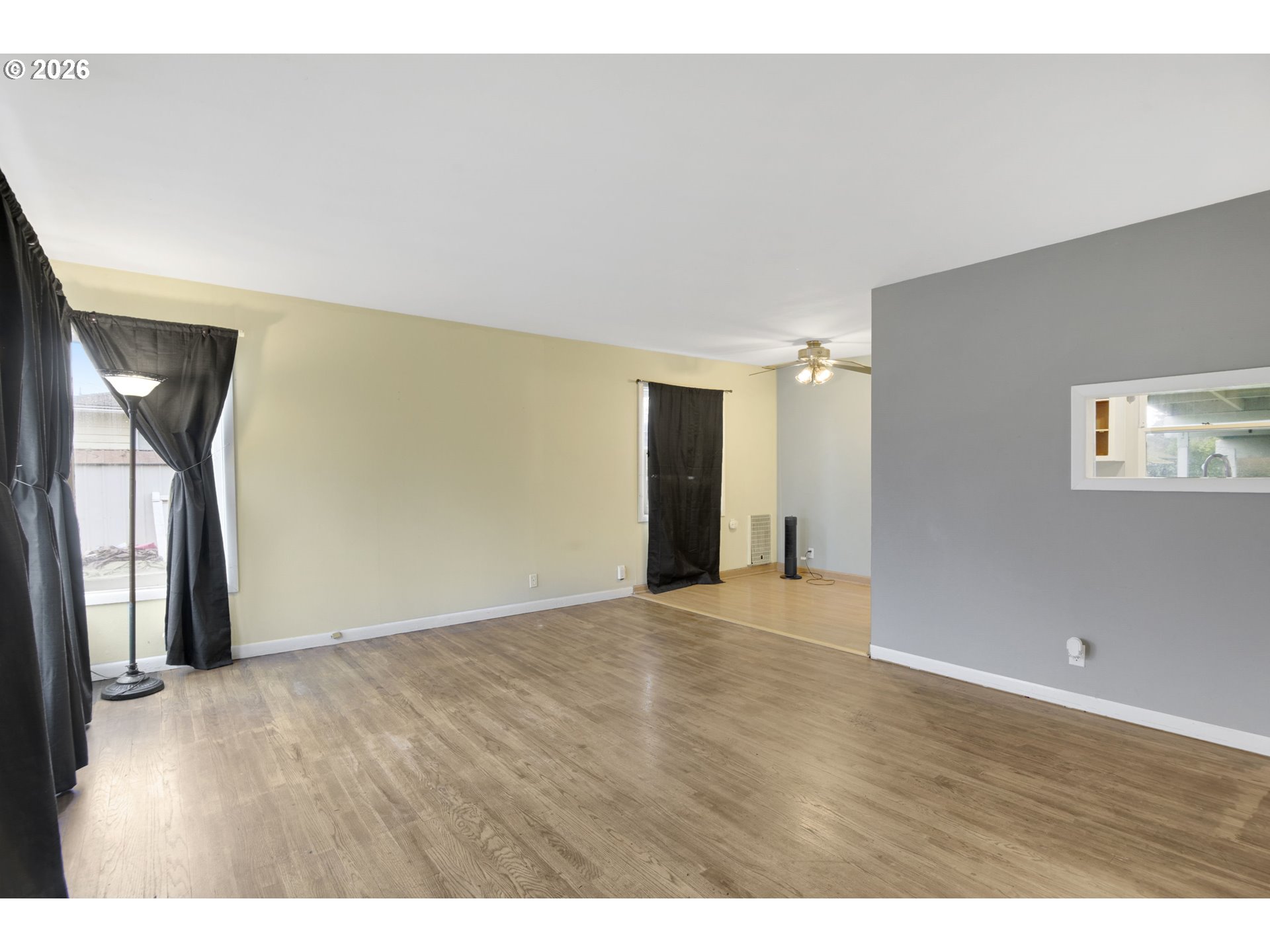 106 North Lieser Road Vancouver, WA 98664 - Photo 4 of 36 a view of an empty room with wooden floor and a window