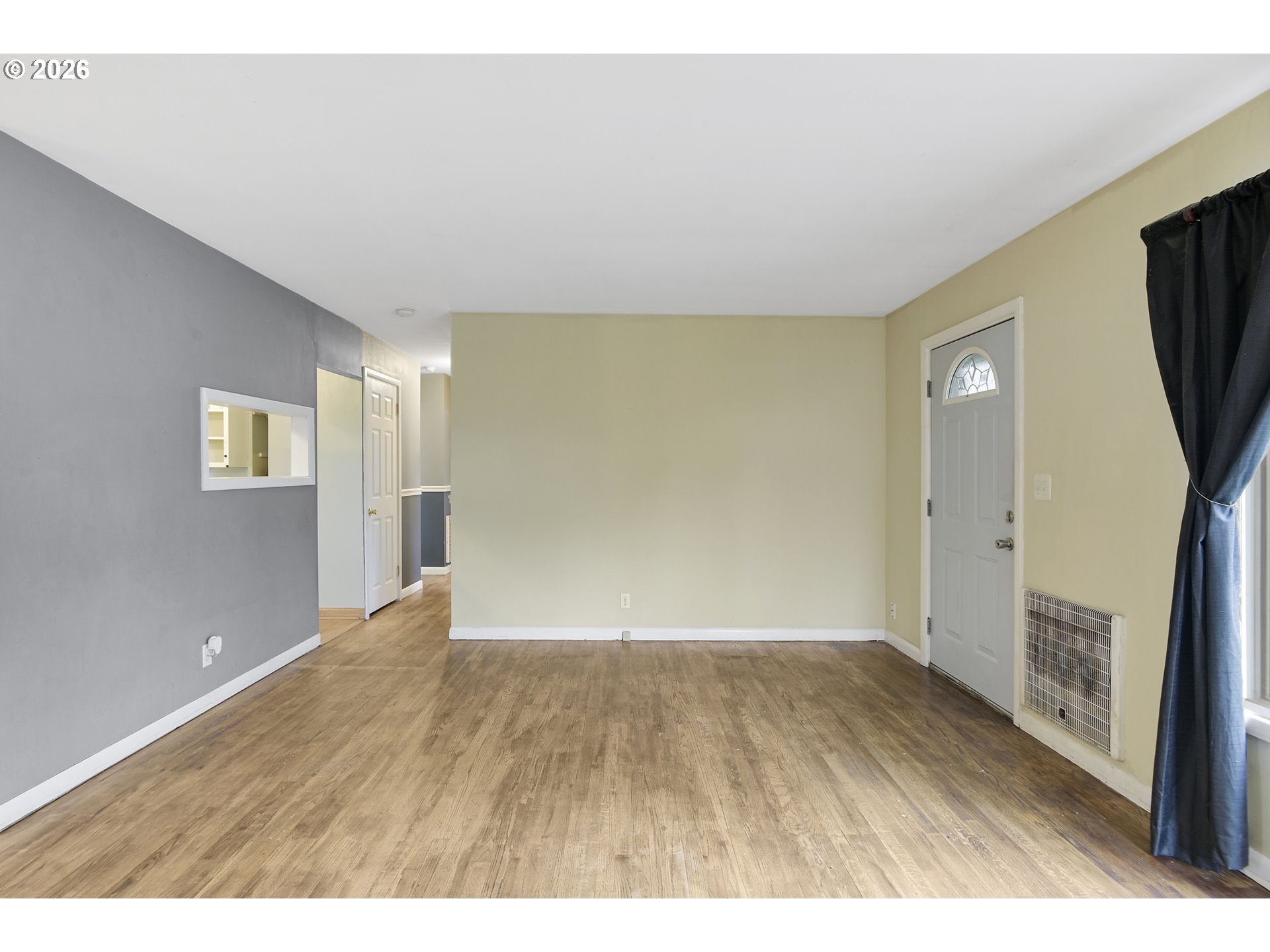 106 North Lieser Road Vancouver, WA 98664 - Photo 6 of 36 a view of an empty room with a fireplace and wooden floor