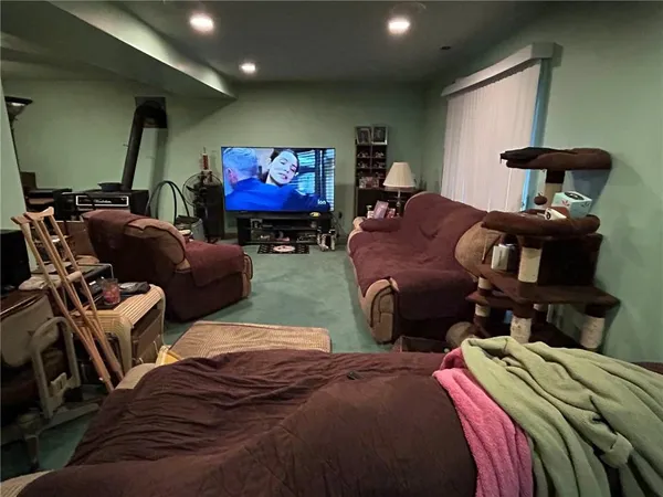 a bedroom with two beds and a gym equipment