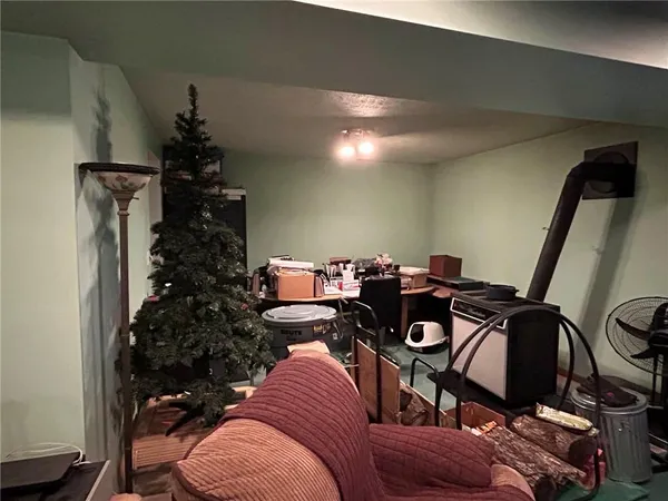 a bed room with a bed and a potted plant