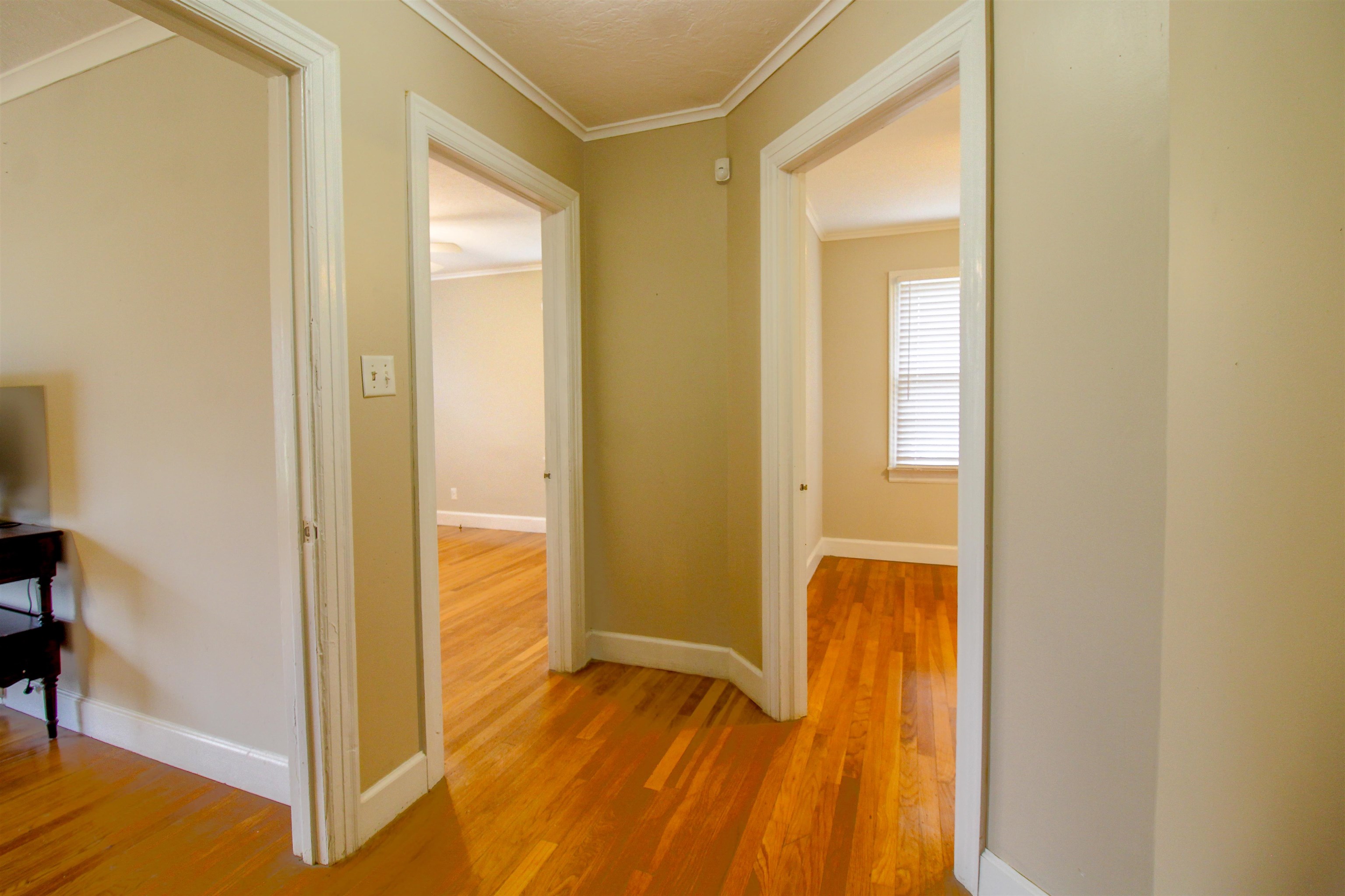 4075 Arp Central Road Ripley, TN 38063 - Photo 26 of 37 Corridor featuring ornamental molding and Original Hardwood floors.