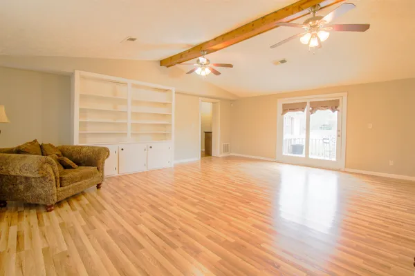 a living room with furniture and a window
