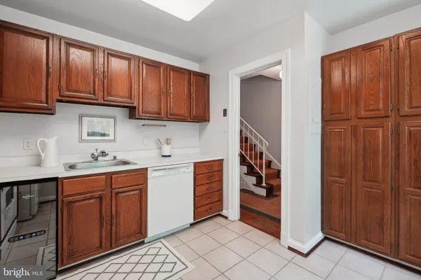 a kitchen with stainless steel appliances granite countertop a refrigerator and cabinets